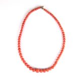 Graduated coral bead necklace.