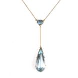 Yellow gold aquamarine pendant necklace.