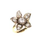 Yellow gold diamond flower ring.