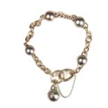 18 ct white gold Tahitian pearl and diamond bracelet.