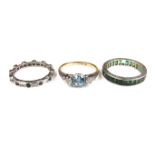 Three gem set rings.