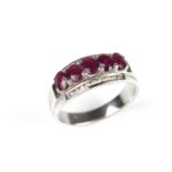 White gold five stone ruby and diamond ring.