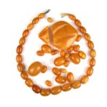 Graduated string of amber beads.