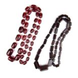 Two faceted cherry amber bead necklaces.