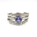 Set of three 18 ct white gold tanzanite and diamond rings.