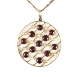 Yellow gold garnet and pearl plaque pendant necklace.