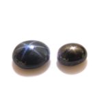 Two loose star sapphire cabochons.