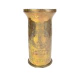 Militaria: A large World War II brass trench art shell case