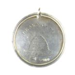 A George III novelty silver medallion pendant