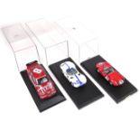 A group of three model racing cars, Alfa Romeo and Maserati