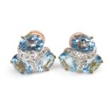 18 ct yellow gold blue topaz and diamond earrings.