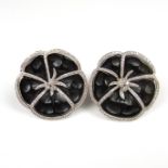 18 ct white gold onyx and diamond clip on flower earrings.
