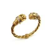 18 ct yellow gold ruby and diamond leopard head hinged bangle.