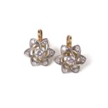 18 ct yellow gold diamond flower earrings.