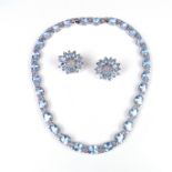 18 ct white gold blue topaz and diamond demi-parure.