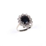 White gold sapphire and diamond flower cluster ring.