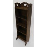 An early 20th century oak arts and crafts five shelf bookcase with pierced design to top shelf 116cm