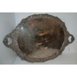 A silver plated twin handles serving tray, oval with pierced rim with fruit and vine embossed