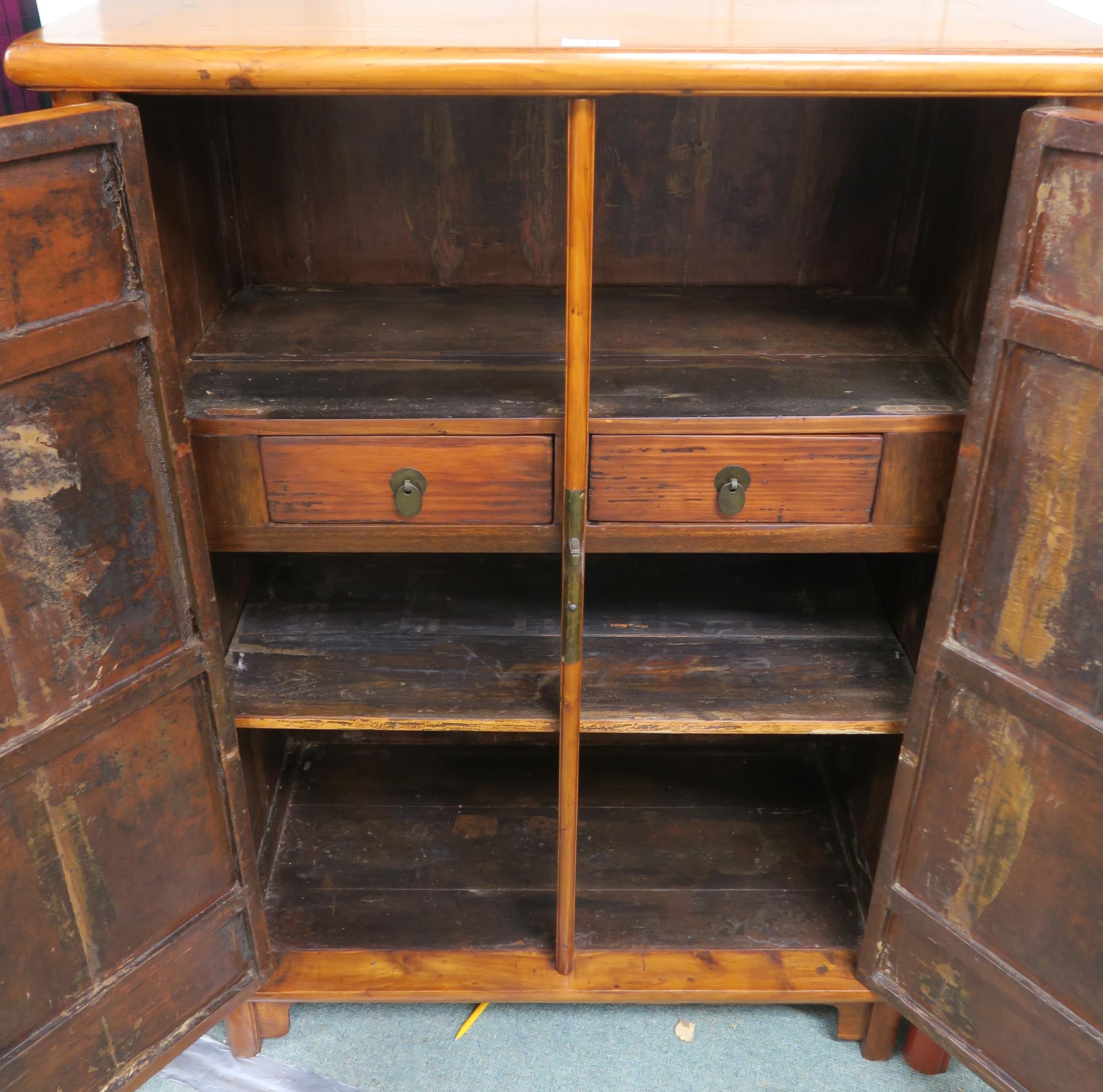 An early 20th century Chinese hardwood two door cabinet with two internal drawers 112cm high x - Image 3 of 4