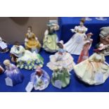 Nine Royal Doulton figures including Coralie, Buttercup, Kathleen, Solitude, Day Dreams, Sunday