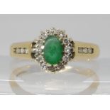 A 9ct gold emerald and diamond cluster ring, size N, weight 2.6gms Emerald worn pebble smooth, no