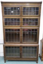 An early 20th century Minty Limited oak sectional bookcase with leaded glass doors 157cm high x 90cm