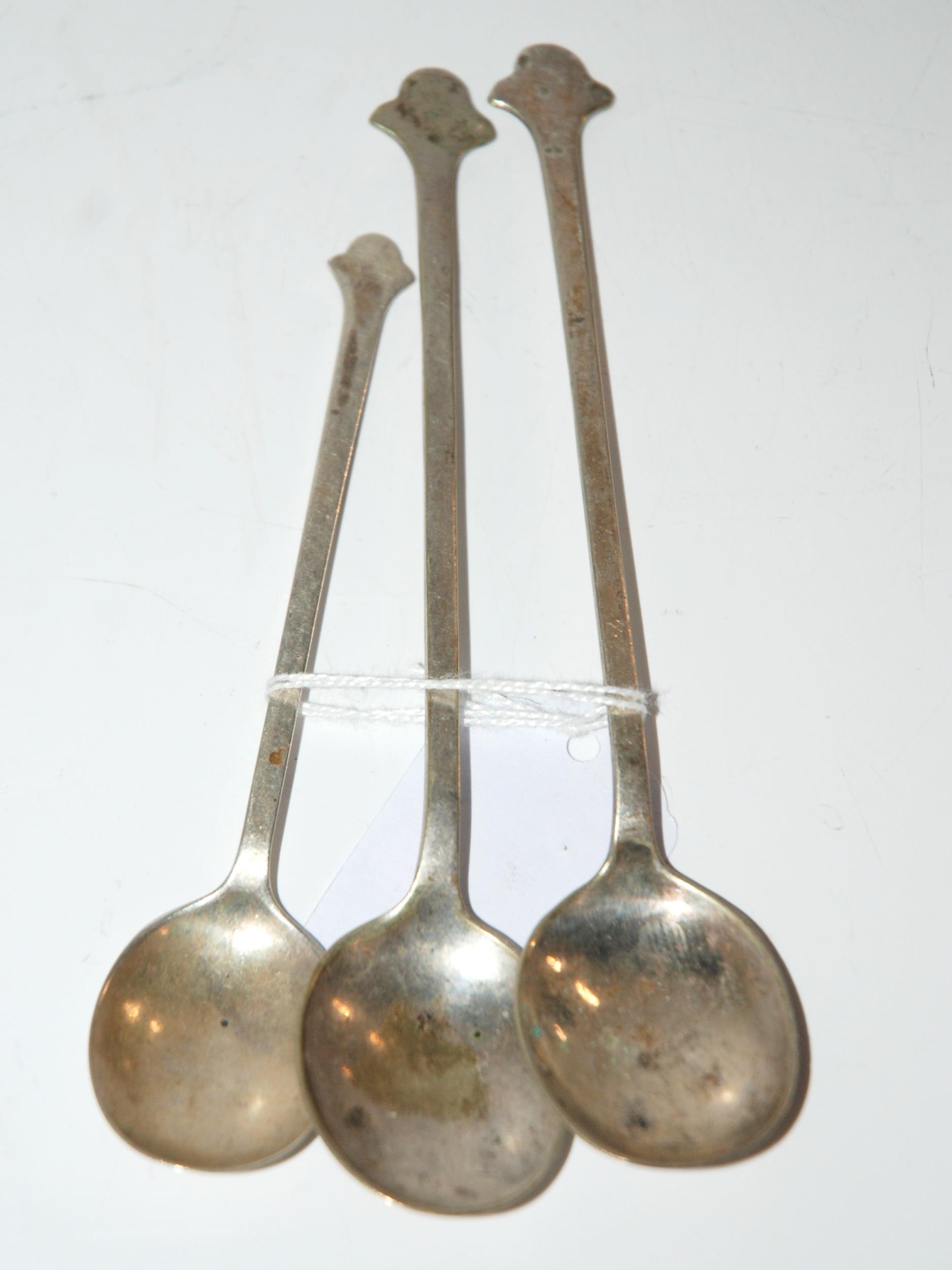 A silver Cranston tearoom style trefoil spoon, Sheffield 1921, 12.5cm long with two similar white-
