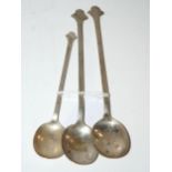 A silver Cranston tearoom style trefoil spoon, Sheffield 1921, 12.5cm long with two similar white-