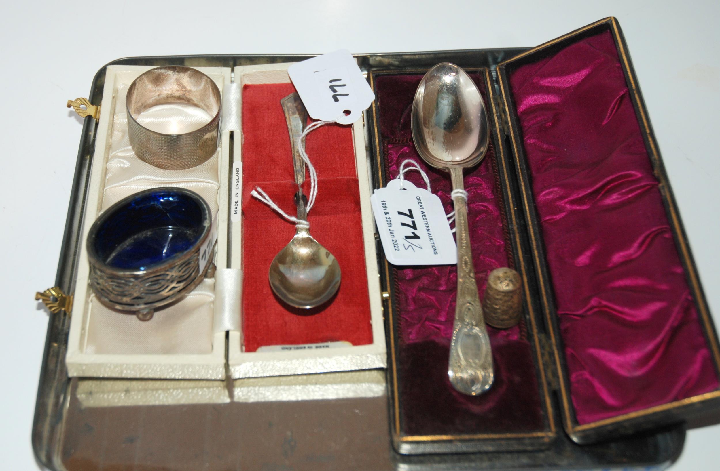 A lot comprising two silver spoons, a thimble, a salt, a napkin ring, all assorted marks (5) 86