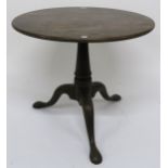 A 19th century mahogany circular tilt top table on tripod base 71cm high x 83cm diameter Condition