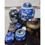 A lot comprising a large Chinese blue and white prunus pattern ginger jar upon hardwood stand,