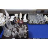 A selection of cut glass and crystal including decanters, paperweights, candlesticks, tumblers and