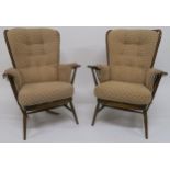 A pair of mid 20th century beech Ercol tall back easy chairs (2) Condition report: Available upon