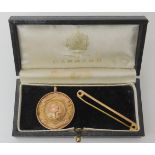 A 9ct gold school football medal, and a 9ct gold bar brooch, weight together 9gms Condition