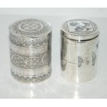 A lot comprising a silver & niello cylindrical box & cover 10 cm high 102 grams & a white metal