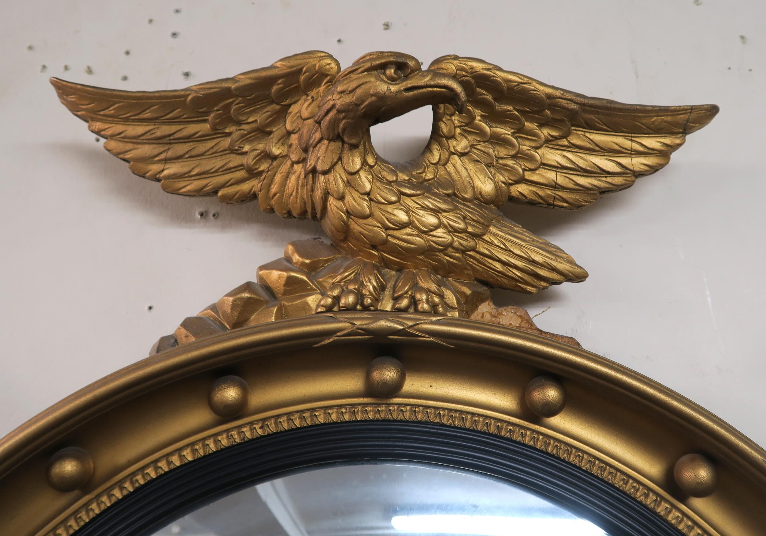 A 20th century gilt framed circular convex mirror with a gilt eagle to top 66cm high x 53cm wide - Image 2 of 2
