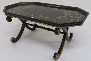 A 20th century lacquered X framed occasional table with painted top 46cm high x 103cm long x 60cm