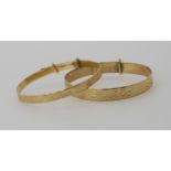 Two 9ct gold children's bangles, weight combined 9.4gms Condition report: Available upon request