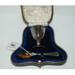 A cased matched two piece silver christening set, an egg cup & a spoon, London 1920/21 Condition