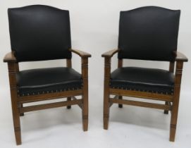 A pair of early 20th century oak framed armchair with black leather upholstery 112cm high
