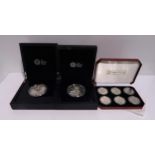 A lot comprising five cased silver proof £10 coins, each 156 grams, with six assorted cased silver