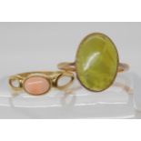 A 9ct Connemara/Iona marble rose gold ring, size Q, and a 9ct gold coral ring size P, weight
