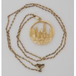 A 14k gold New York skyline pendant with a yellow metal chain, weight 10.8gms Condition report:
