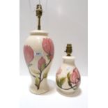 Two Moorcroft Magnolia pattern table lamps Both in nice condition.