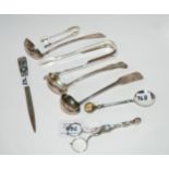 A lot comprising three silver sauce ladles, two pairs of tongs, sugar nips, a citrine set spoon &