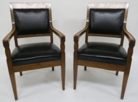 A pair of early 20th century oak framed armchairs with leather upholstery 99cm high Condition