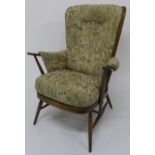 A mid 20th century beech Ercol tall back easy chair Condition report: Available upon request