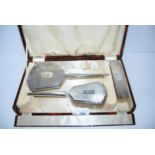 A cased three-piece silver dressing table set, Birmingham 1936 Condition report: Available upon