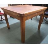 A 20th century oak pullout dining table 77cm high x 99cm long x 97cm deep Condition report: