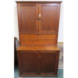 A 20th century beech secretary cabinet with two doors above fall front above two further doors 191cm